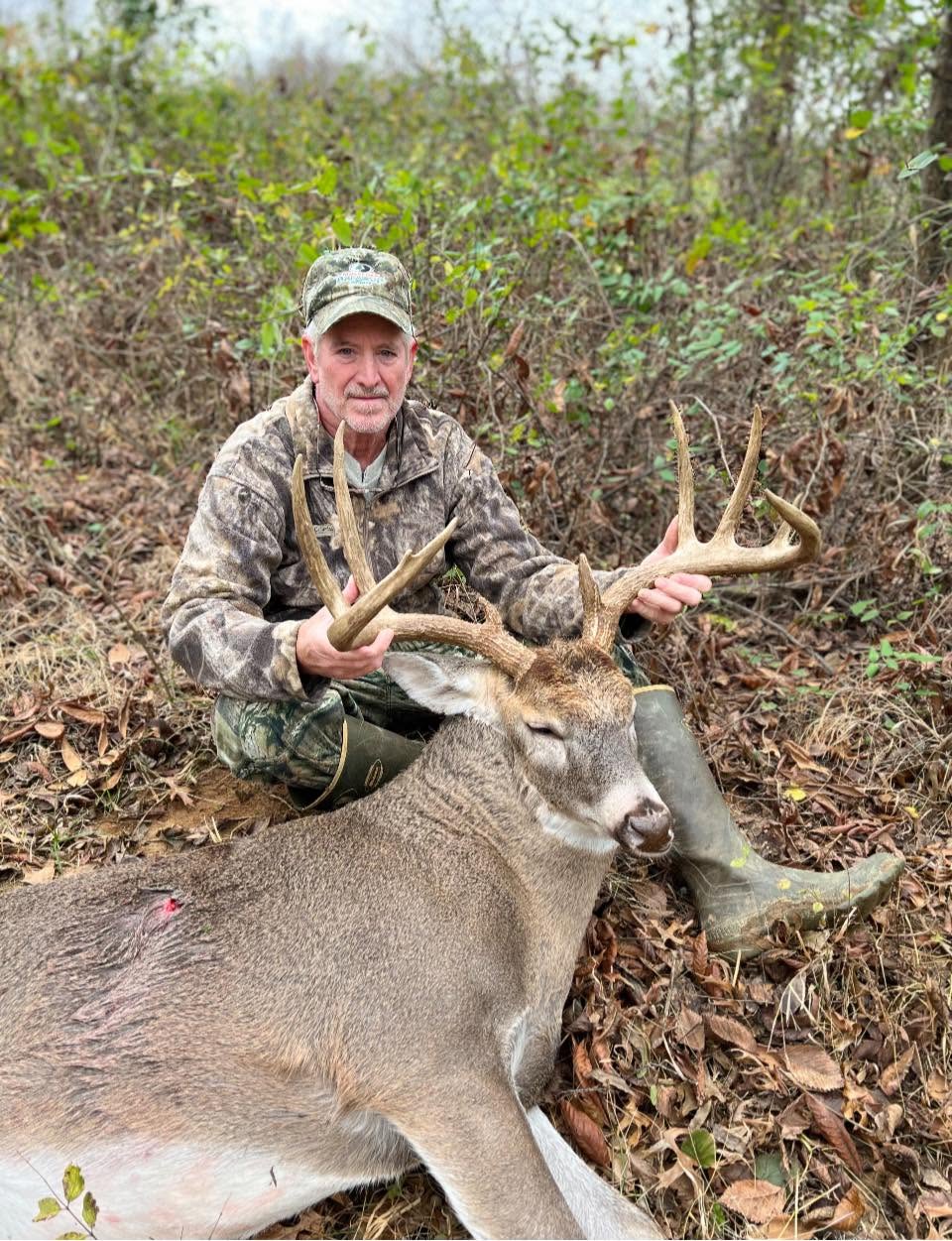 Ben Mears with a whitetail buck he harvested — click to enlarge